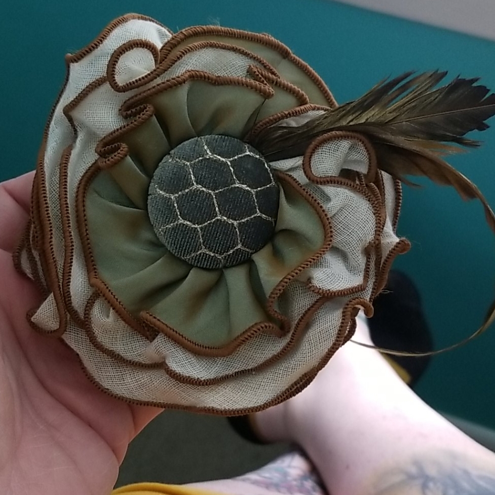 Brown and green fascinator